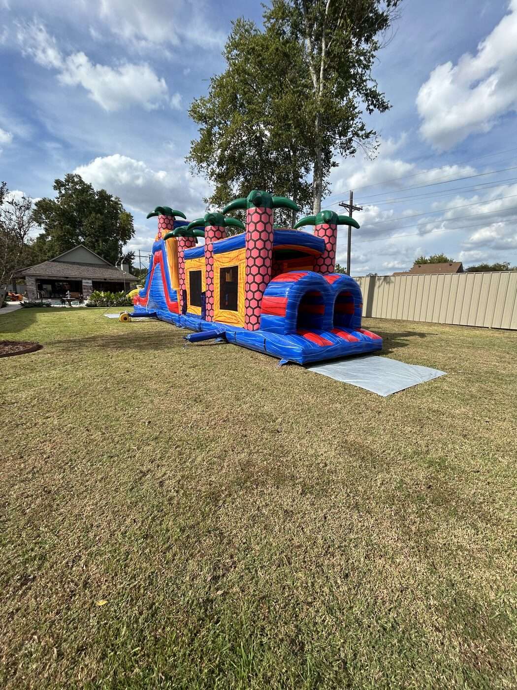 kids racing through an inflatable obstacle course in Maurice, LA
